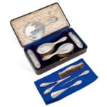 A GEORGE V SILVER-MOUNTED DRESSING TABLE VANITY SET