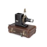 ꩜ A Leitz Gnom II Projector in Brown SFUUE Transport Case,