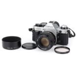 A Canon AE-1 Program 35mm SLR Camera,