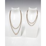 Two yellow metal guard chains, both with a clasp stamped 9ct