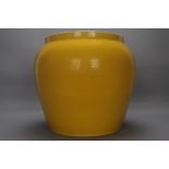 A large yellow-glazed jar with carved double dragons from the Yongle reign of the Ming Dynasty