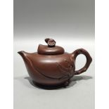 A rare antique purple clay teapot with the inscription "Jiang Rong" on the bottom, featuring a bat m