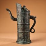 A pair of bronze bamboo-shaped pots with inscriptions