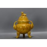 A Ming Hongzhi yellow-glazed incense burner with carved phoenix pattern is 24 cm high, 10.8 cm in di