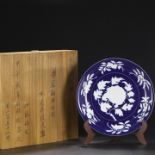 A large plate with a Xuande blue glaze and floral patterns from the Ming Dynasty, formerly in the co