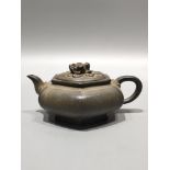 A rare antique Yixing teapot, bearing the inscription "China Yixing" on the bottom and the mark "Gui