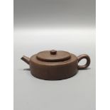 A rare, antique purple clay teapot, with an inscription on the bottom reading "Chongzhen Guiyou Year