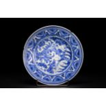 A Safavid Blue and White Pottery Dish with Floral Arabesques, 17th Century. A Persian Safavid