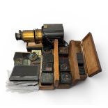 Magic Lantern With large quantity of slides in three wooden boxes. Slides Include: Old Mother