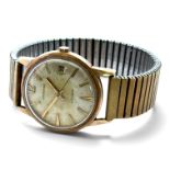 A Garrard gents automatic bracelet watch, Arabic hour marker at 12, arrow and baton markers, and