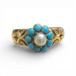 A Victorian "15ct" stamped turquoise and seed pearl dress ring. Featuring a central split pearl,