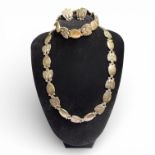 A Georg Jensen "bittersweet" suite of necklace, bracelet and earrings. The necklace is hallmarked