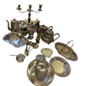 A collection of silver plate comprising tea pots, a single candelabra other items.  Together with an