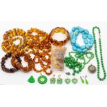 A collection o Chinese jadeite type and glass jewellery including earrings, beads, pendants etc
