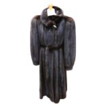 A Martin Dyksman full-length black ranch mink coat, c.1980, with a small collar (can be worn as a