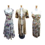 A silk chiffon late 1940s evening dress in a floral and foliage print in an array of colours in a