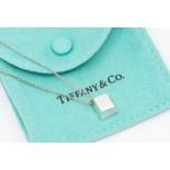 Tiffany & Co- a silver pendant and chain, comprising rectangular form, measures approx 10 x 8mm,