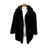 A 1980s/90s 3/4 length dark brown faux fur coat with peter pan collar.