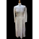 A wedding dress from 19 October 1966, the dress was made by a company in Hong Kong, it is made from