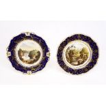 Two Bloor Derby plates, cobalt blue and gilt ground, with painted central scenes, both titled View