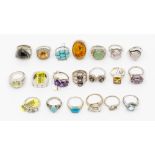 A collection of twenty silver stone set dress rings, comprising various styles and types of stone,