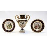 An early 19th Century Derby Bloor twin handled urn vase, cobalt blue with gilt detail and hand