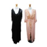 A late 1970s Lesley Sandra full length black chiffon evening dress with a large V over collar shawl