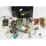 A collection of costume jewellery to include silver and white metal charm bracelets, smoky quartz