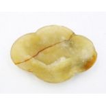 A Chinese jade "ear" cup, 19th/20th century, copy of a Han Dynasty example often found in tombs,