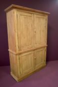 A large pine antique kitchen/linen cupboard with two internal shelves to top section and a single