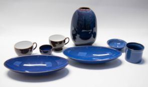 A collection of Denby wares blue ground bowls, pots, vase with two Denby large coffee/chocolate