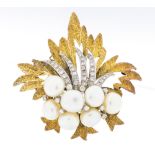 A vintage diamond and cultured pearl set 14ct gold brooch, comprising a foliate design of textured