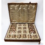 A Royal Crown Derby 2451 Imari patterned coffee cup and saucer set, twelve in total and in