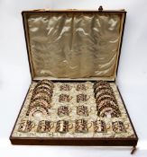 A Royal Crown Derby 2451 Imari patterned coffee cup and saucer set, twelve in total and in