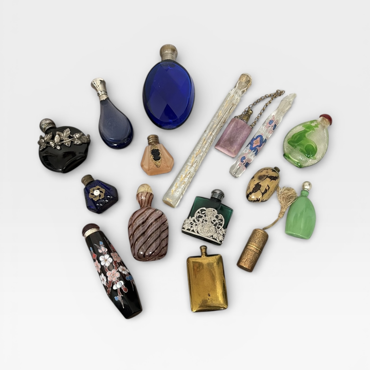A selection of scent bottles, to include a tagua nut scent bottle, two painted glass long phials/sce