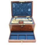 An early to mid 19th century rosewood cased brass bound vanity box, with hinged cover opening to
