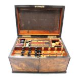 A 19th Century mahogany and burr veneer travelling games chest, having brass keyhole surround and