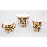3 pieces of Royal Crown Derby in the 1128 Imari pattern, to include a Loving Cup , a mid size