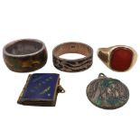 An early 20th century 9ct carnelian signet ring, size U, weight 4g together with two silver rings,
