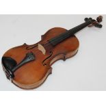 A late 19th century full size violin. Maggini label. Back length 35cm ( excluding button). Cased