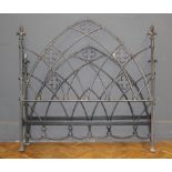 A wrought and cast iron Gothic Arch form 5' bed frame with side rails