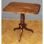 An early 19th century mahogany tripod table, the rectangular snap top raised on bobbin turned