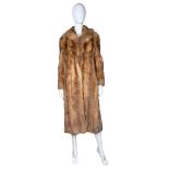 A shaggy orange / fire fox fur coat C1970s with ginger satin lining. There is an internal swing