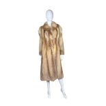 A vintage red fox fur coat with mocha jaquard lining, notched collar and furrier clips to fasten