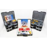 A collection of four Meccano plastic carry cases, containing a collection of assorted vintage and