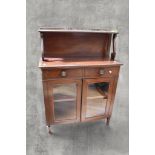 A Victorian mahogany chiffonier with back board, gallery top with scrolled supports above two frieze