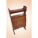 Art Nouveau mahogany book trough cabinet with side elongated flower bud carvings and ornate