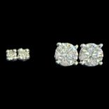 Two pairs of diamond stud earrings. Comprising a pair of 18ct white gold hallmarked stud earrings,
