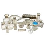 A collection of mixed silver topped or collared scent or vanity bottles to include: a Birmingham