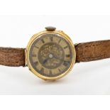An early 20th century 18ct gold cased wristwatch, comprising a gilt engraved dial with numeral